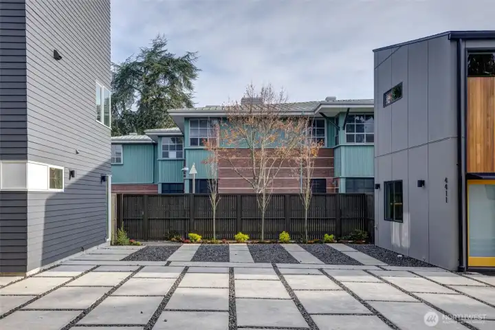 Mindful low-maintenance plantings enhance the site with natural lines and year-round color. Dedicated off-street parking for each home.
