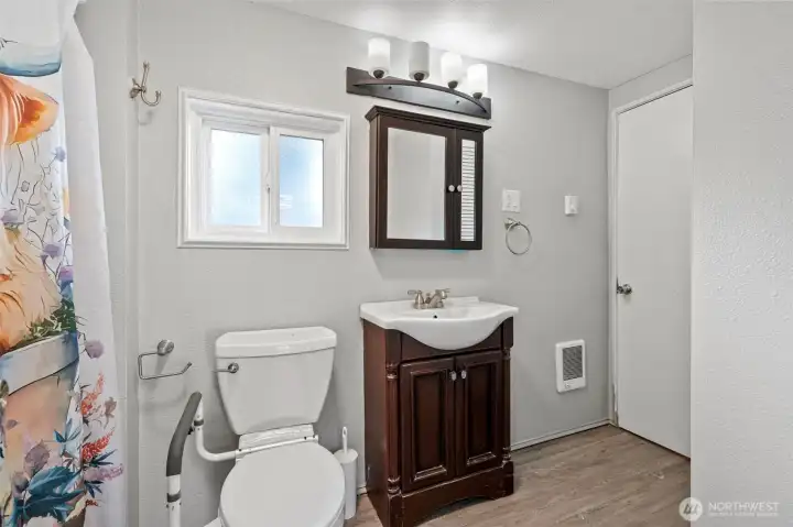 Full Bathroom- jack and Jill from primary and into hallway by laundry room