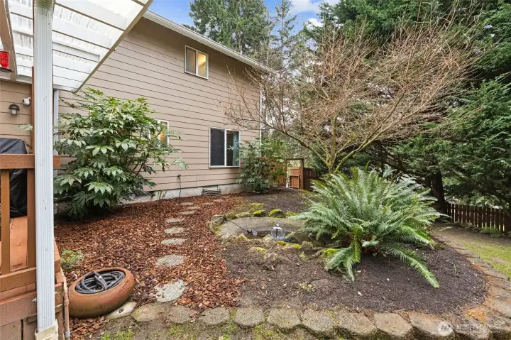 Water feature adds to the serenity of the back yard.
