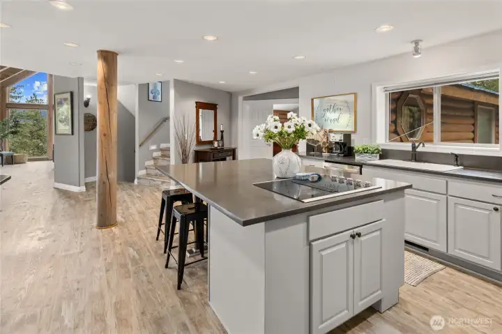 The open concept floor plan seamlessly flows from the kitchen to the dining area and into the great room.