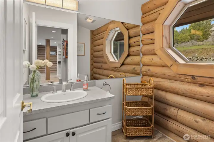 A charming half bath is also located on the main floor.