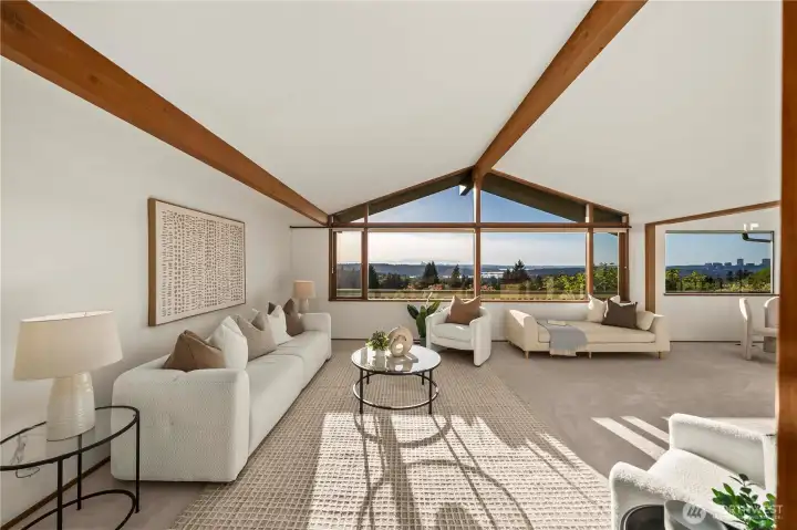 The expansive living room, and stunning views of Lake Washington, the I-90 bridge, and the city skyline together create a truly elevated living experience.