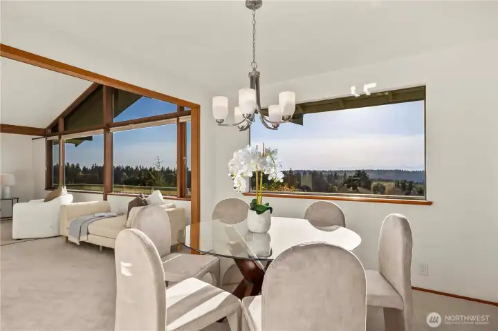 The formal dining area, located adjacent to the living room, also enjoys stunning views