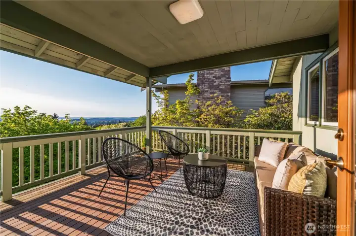 The formal dining room seamlessly extends to a view deck, enhancing indoor-outdoor living