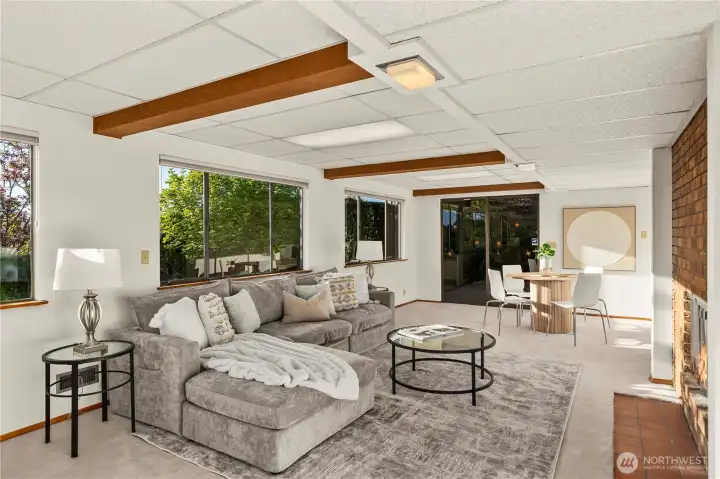 An expansive bonus room overlooking a private, beautifully landscaped backyard—ideal for relaxation or entertaining.