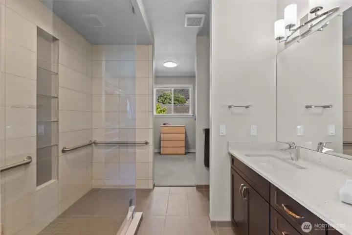 Custom porcelain tile shower, walk-in Closet with a window! Natural light to see what you want to wear!