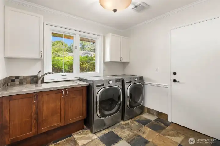 Laundry room on the main level, also leads to the 3-car garage.