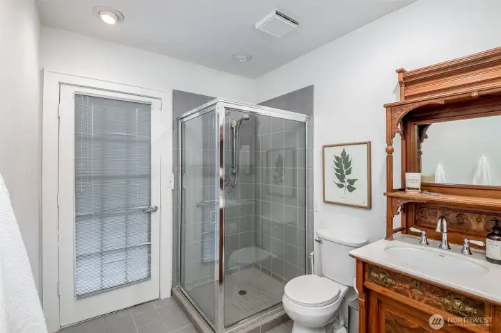 The door in the bathroom leads out to a deck.