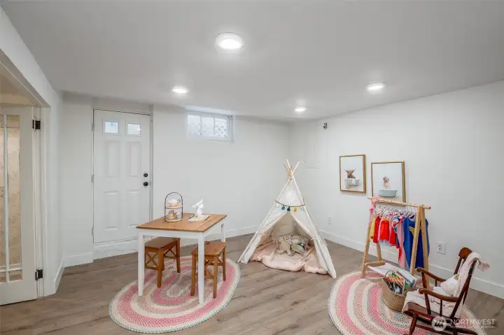 Enjoy this flexible room, with newly installed LVP. So many options here, even a bedroom with the egress right there. The adjacent room could serve as a closet.