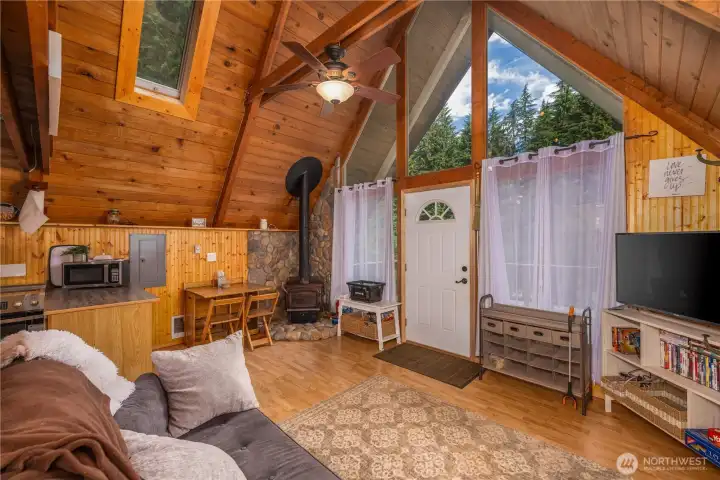 Wood stove with stone back drop finishes this cabin aesthetic.