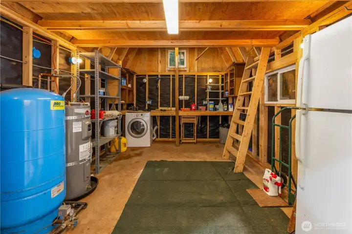 Includes loft, workbench, dryer, and existing plumbing/power for future washer.