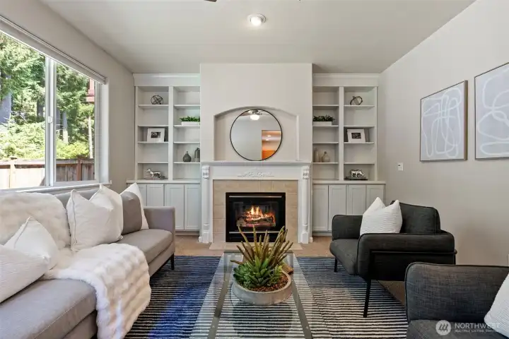 Second living space with  abundant natural light, built-ins, and a gas fireplace (which was recently serviced and all major parts replaced in December 2025 and February 2026).