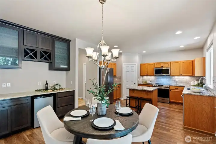 Kitchen with a coffee bar, beverage fridge and eating space.