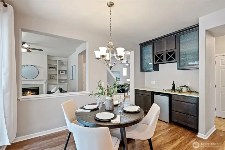 Kitchen with a coffee bar, beverage fridge and eating space.