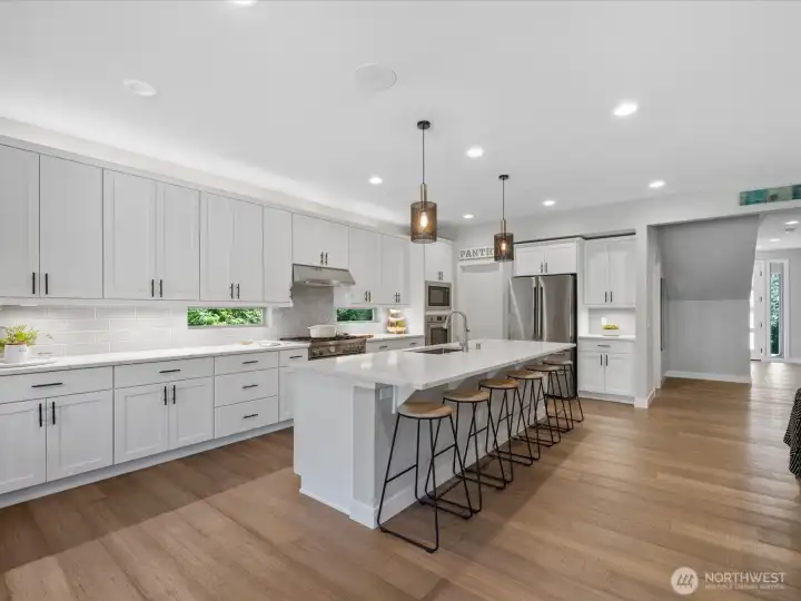 Gourmet kitchen with ample workspace, storage, and gathering space Gourmet kitchen with ample workspace, storage, and gathering space