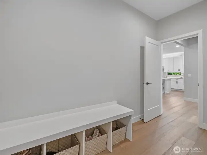 Functional mudroom with built-in storage, organization, and convenient access to the garage Functional mudroom with built-in storage, organization, and convenient access to the garage