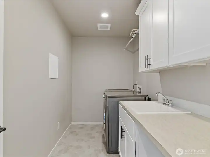 Upstairs laundry room with functionality and storage in mind Upstairs laundry room with functionality and storage in mind