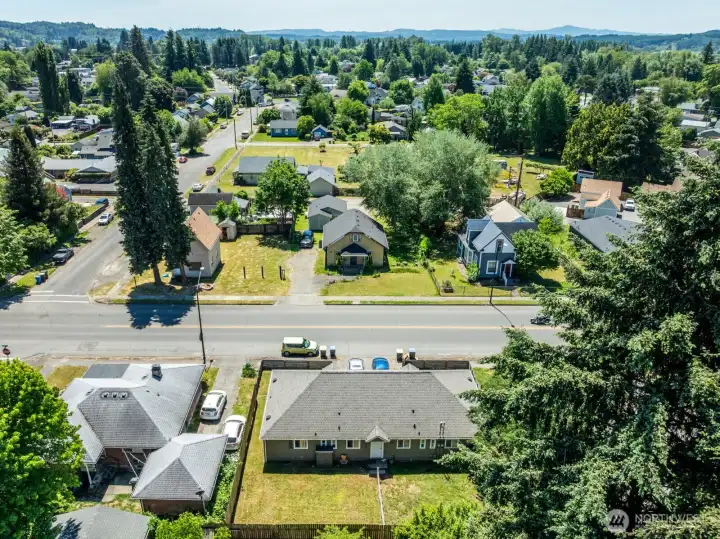 Aerial perspective of the property and surrounding area, showcasing the neighborhood setting and nearby amenities.