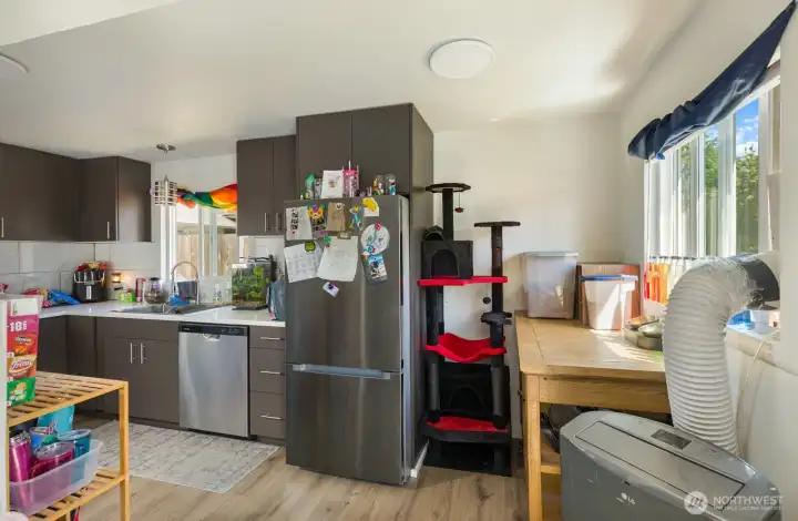 Kitchen offers ample cabinet storage, durable surfaces, and stainless steel appliances.