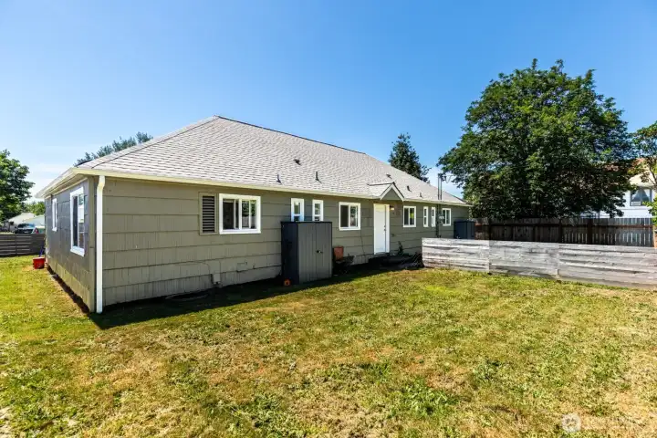 Rear exterior showcases private outdoor space and fenced yard.