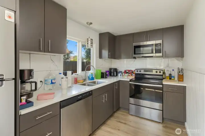 Updated kitchen features stainless steel appliances, ample cabinetry, and efficient workspace for everyday meal preparation.