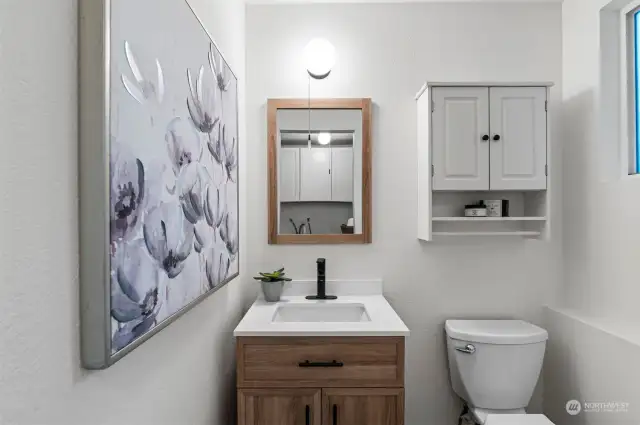 Utility room also features a half-bath with updated fixtures.