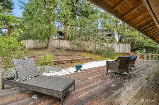 Massive back deck that wraps around to the front of the home.