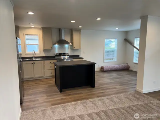 View of kitchen and dining area from living room.