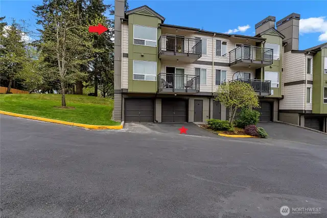 End unit with attached garage and parking space