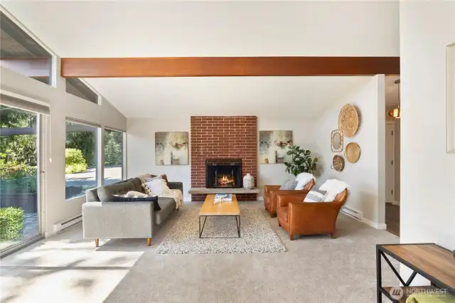 Floor-to-ceiling windows flood the room with natural light and bring the outdoors in.