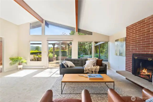 Floor-to-ceiling windows flood the room with natural light and bring the outdoors in.