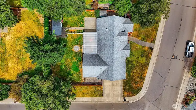 larger fully fenced corner lot with side driveway to garage and plenty of wide street parking