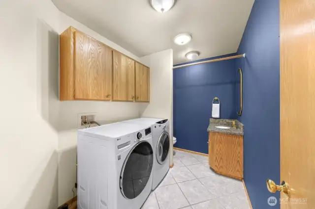 Spacious Laundry room / half bath off kitchen with almost new large load washer/dryer
