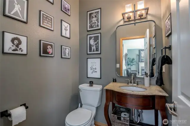 Powder room on the main is quite Cutesy & Demere!