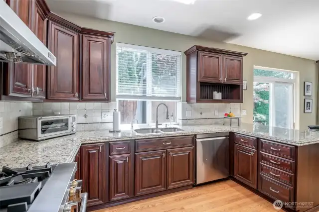 Amazing Kitchen!  Custom Cabinets & Granite Counters + Commercial Jenn Air Gas Oven & Cook Top w/ Commercial Vent Hood.  Refrigerator also Jenn Air.  All APPLIACNES Convey!