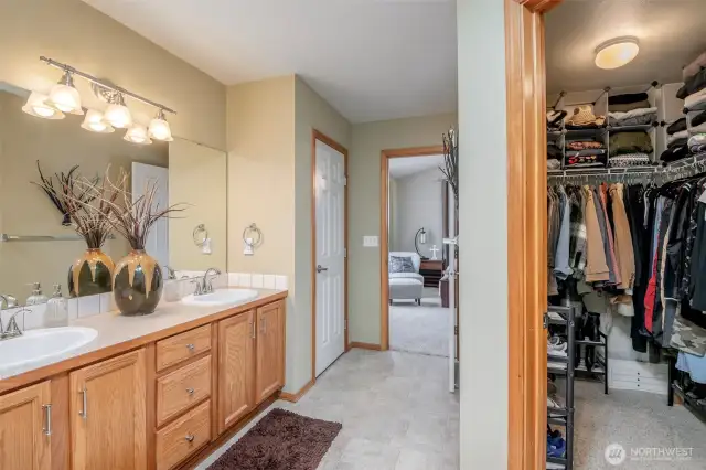 Primary Bedroom has Vaulted Ceilings, nice window for letting in the daylight, a huge walk in closet, 5 piece bath + large vanity.