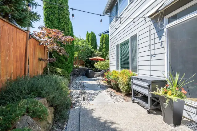 Lovely Hardscape surrounding the exterior for convenient acces to enjoy all of this parcel. Very low maintenance.  Lots of seating areas.