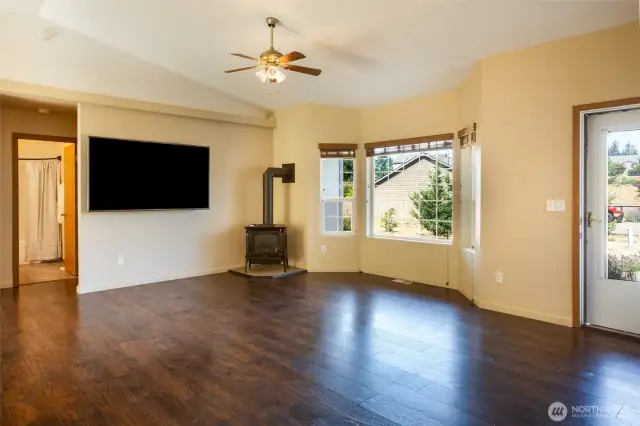 The layout of the living room gives you lots of choices for furniture placement.. By the way, that Smart TV is an LG and it stays with the house.