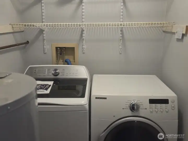 Enclosed laundry and water heater.