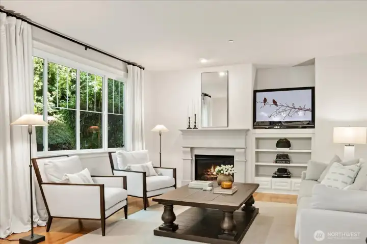 Family Room with backyard green views, and the sound of the soothing backyard waterfall.