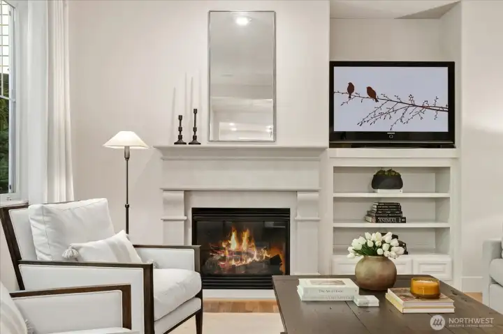 Custom-made Indiana stone fireplace with built-ins and other architectural detailing!