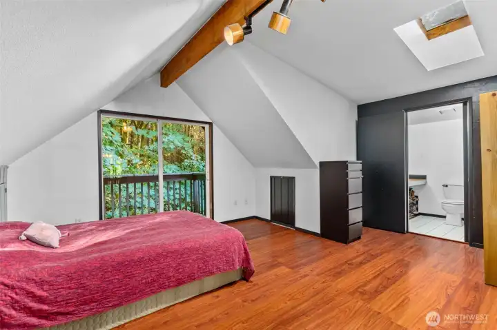 Upper level primary suite has a private balcony/deck