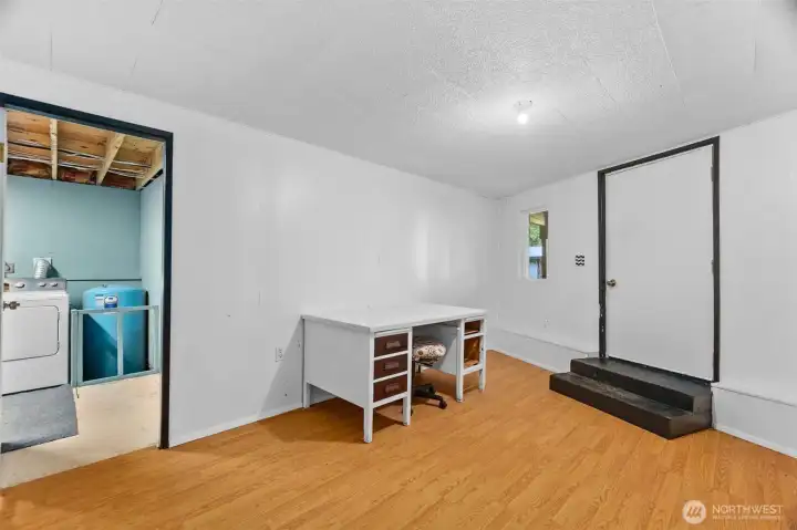 Lower level family room with exterior door. This space could be an ADU with its private entrance