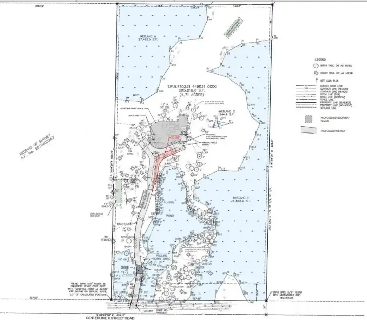 Architectural/site plan highlighting property features, wetlands, and a conceptual build layout. Provided for visual reference; lot is vacant
