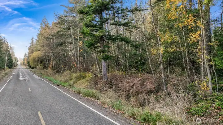 Side view of the property showing the adjacent roadway