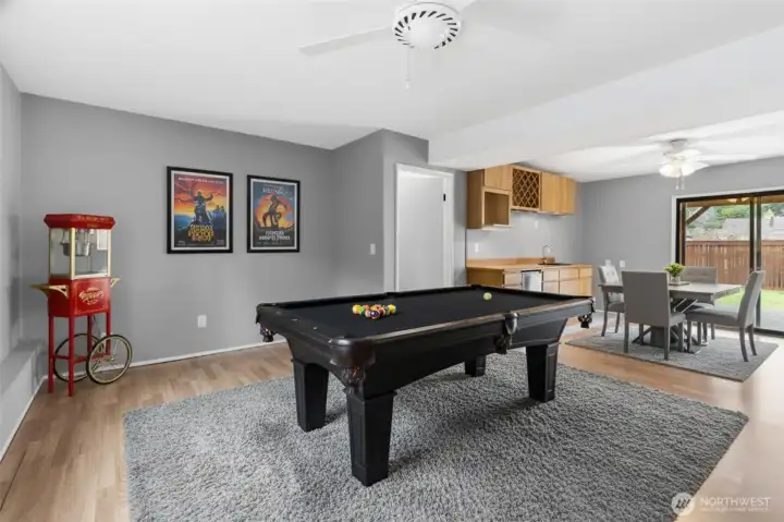 Large family room view toward the right is patio access-Virtually staged. Furniture and décor shown are for illustrative purposes only.