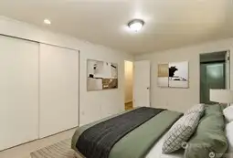 Main floor primary bedroom - virtually staged