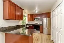 Kitchen features a new refrigerator, dishwasher and microwave