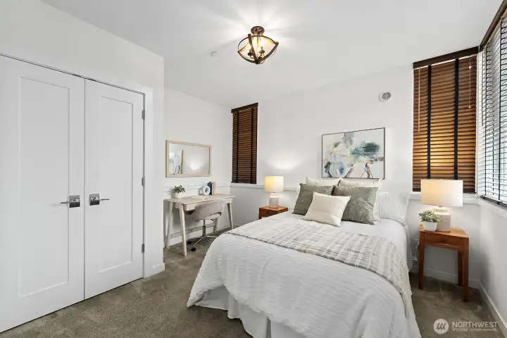 The second bedroom on the mail level with a large closet and space for a desk.