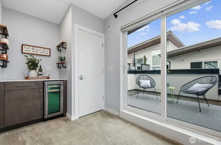A handy built-in mini bar and beverage fridge is right outside the deck.